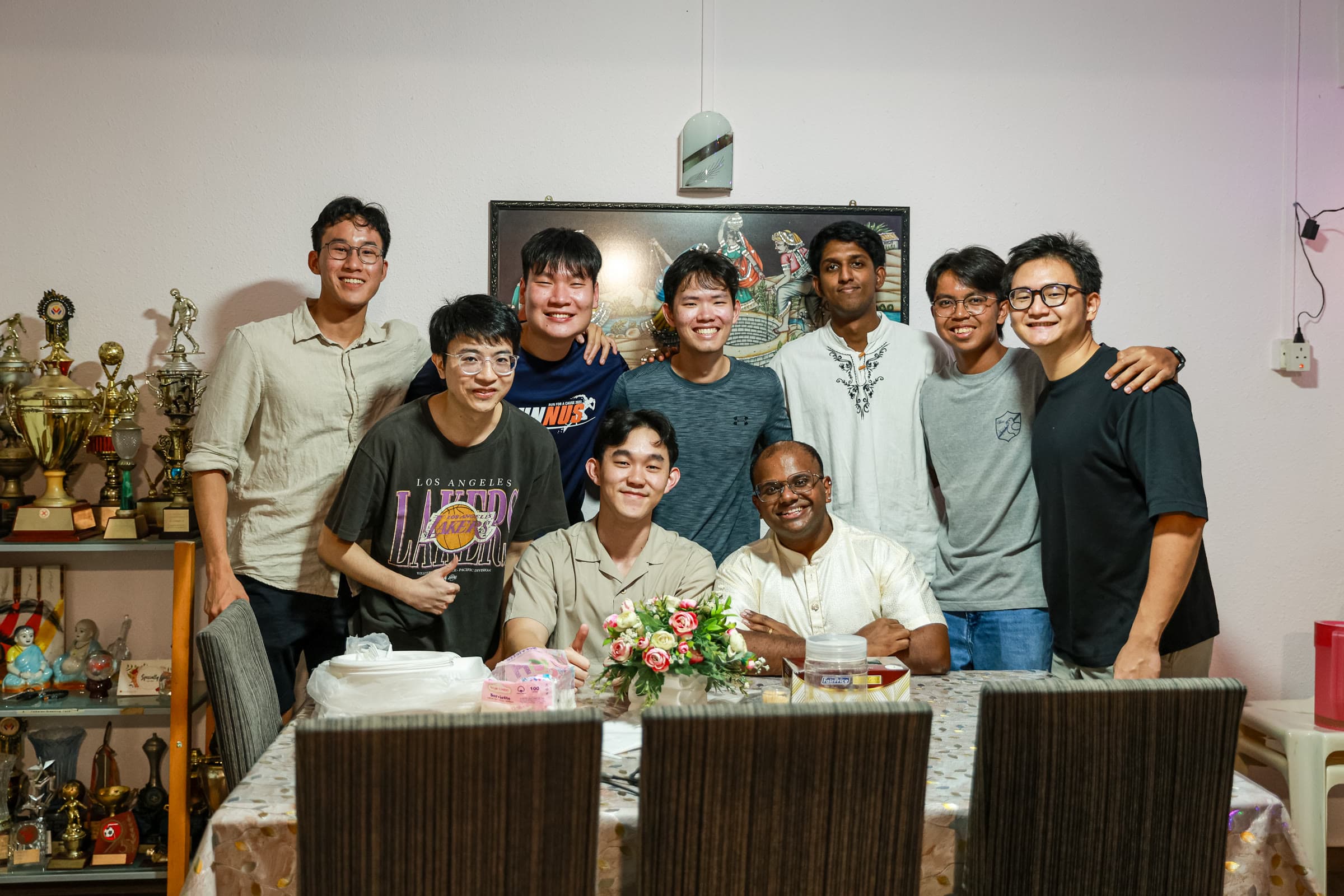 NUS College friends gathered around a dinner table