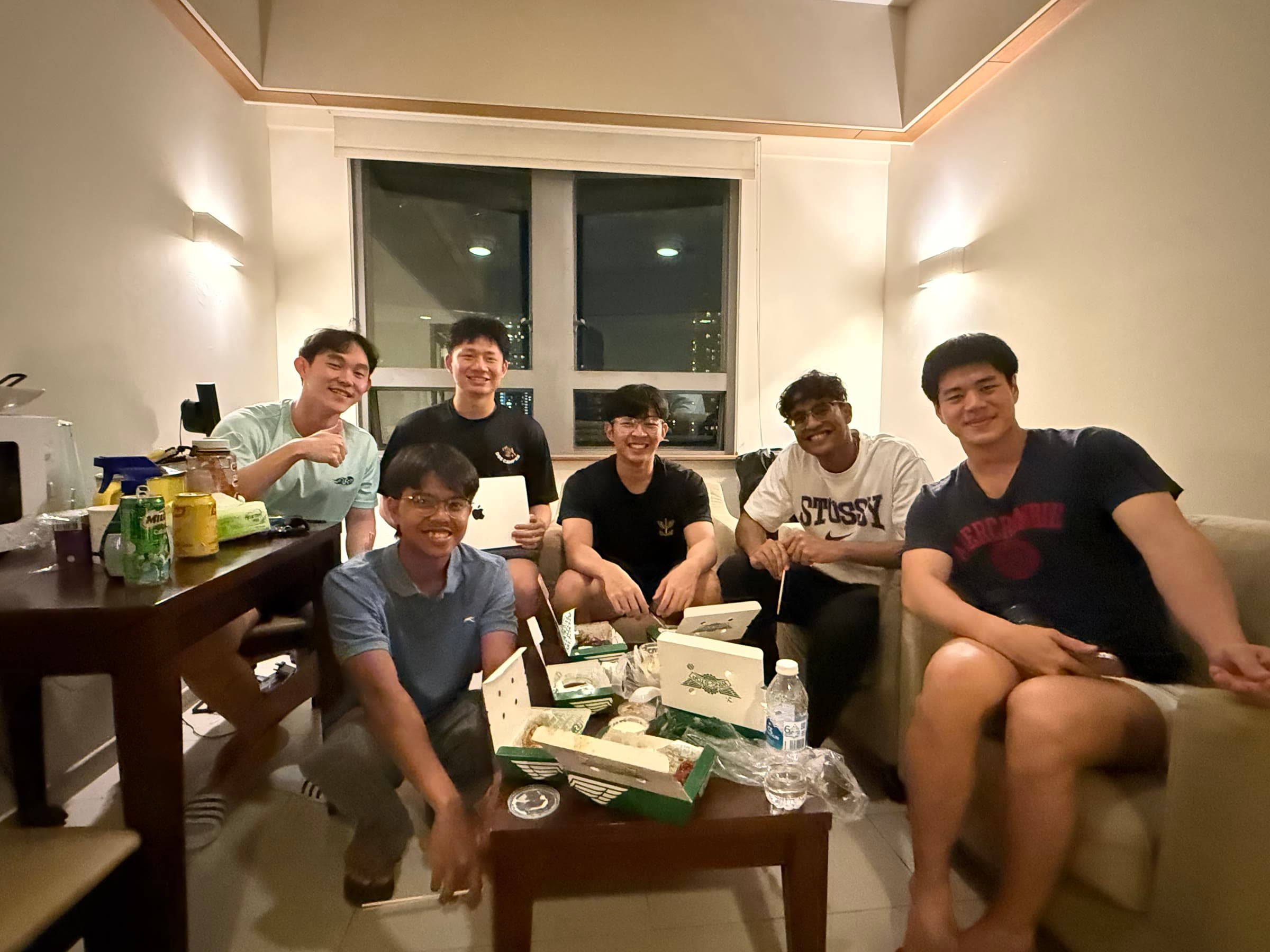 NUS College friends hanging out in a living room
