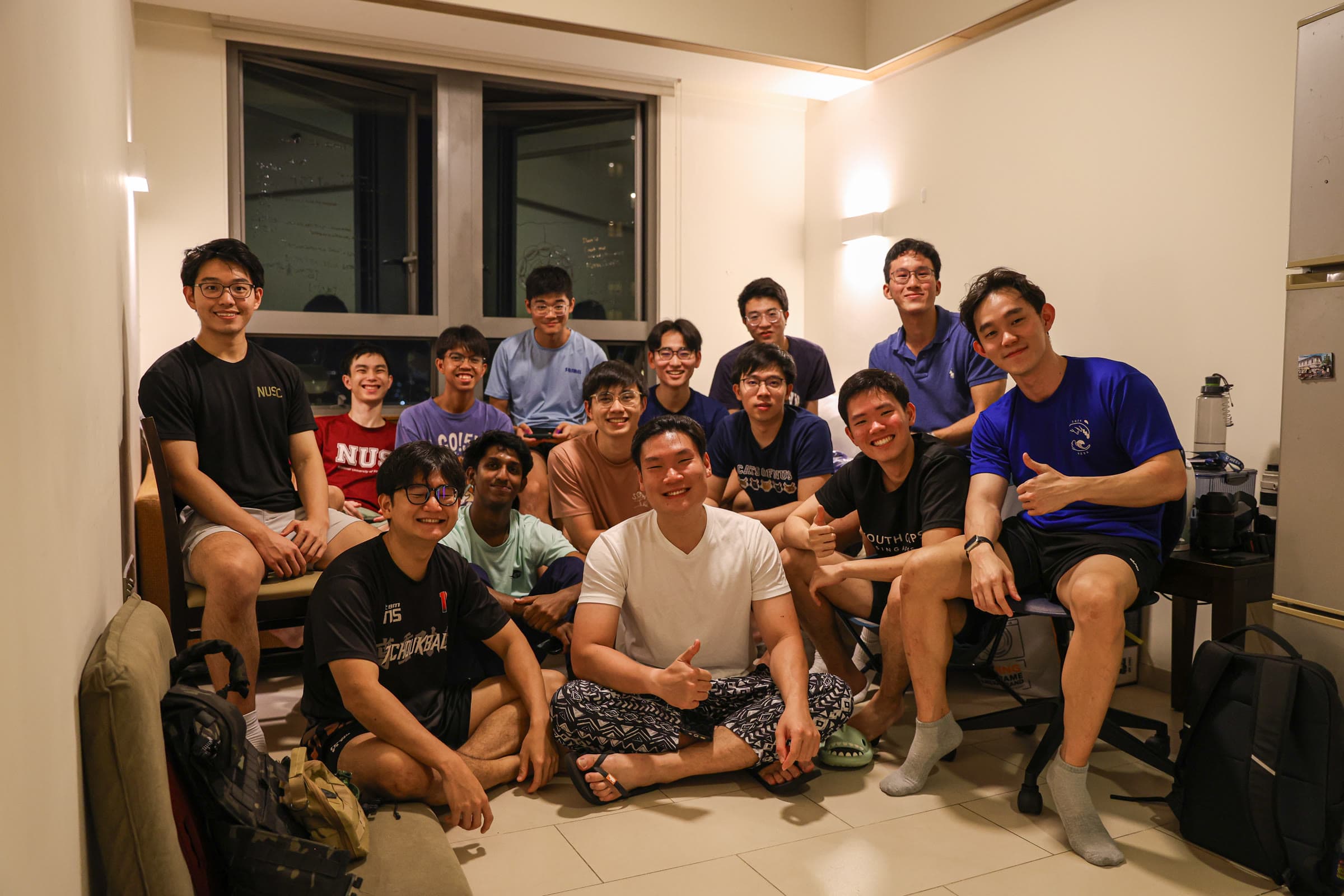 A big group of NUS College friends gathered in a room