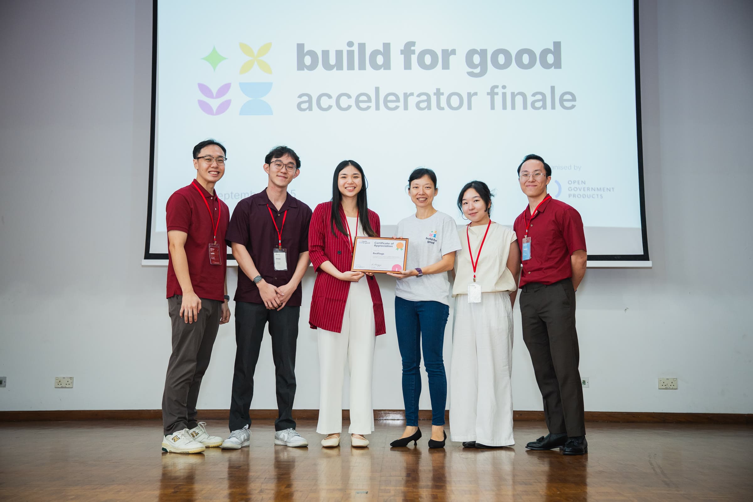 The Redflags team on stage at the Build for Good accelerator finale